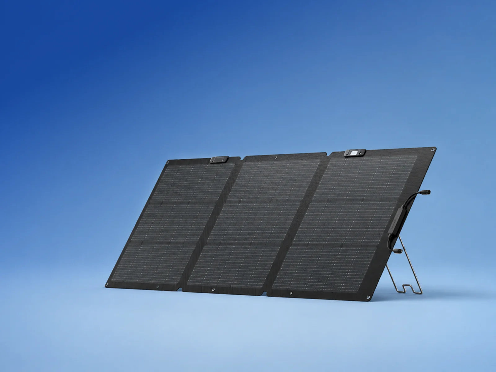 Portable solar panel under a clear blue sky for charging Sierro 2000